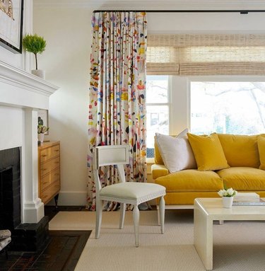A wrapped curtain rod in a colorful living room