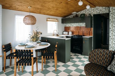 renovated caravan with Palm Spring inspired kitchen with bamboo blind