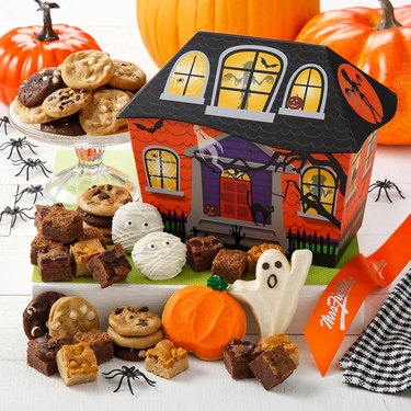 halloween-themed cookies in haunted house box