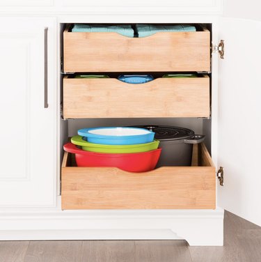 small kitchen organization idea with roll out drawers in the cabinet