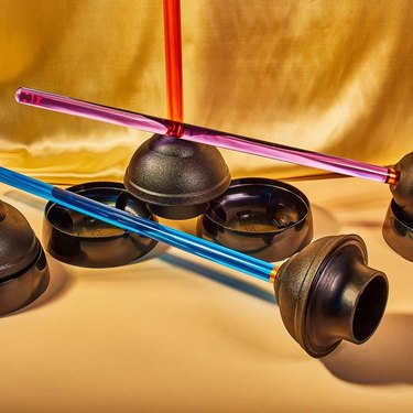 black plungers with colorful handles