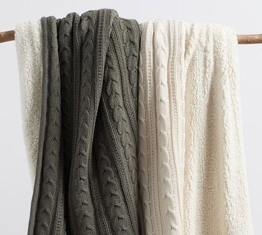 Knit throws with fleece lining