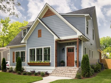 light gray siding with black roof and wood accents