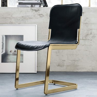 black and brass chair
