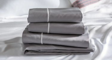 gray stacked linens with white stripe accent