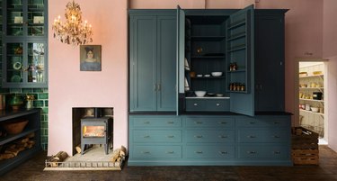 pink kitchen with teal countertop cabinet