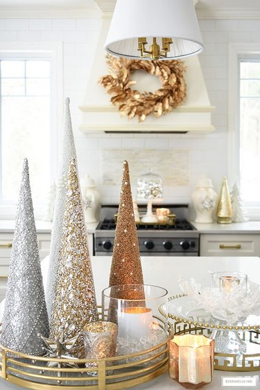 Cone-shaped tree ornaments on top of kitchen worktops