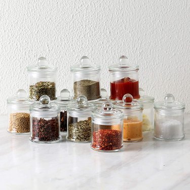 spice jars with herbs inside