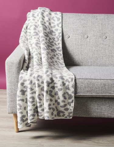 gray and white leopard throw