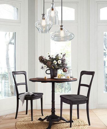 dining room table with two chairs and light