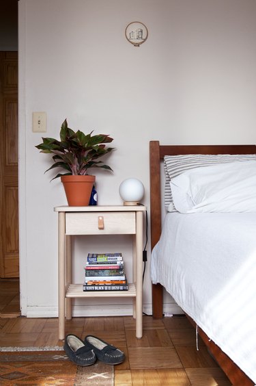 Plant on a bedside table in bohemian living room