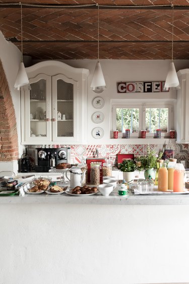 White kitchen island with food preparation