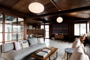 Midcentury paneled living room with long rectangular windows