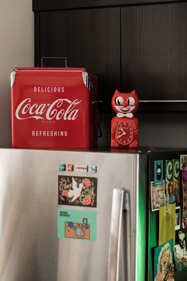 Stainless steel refrigerator with vintage coca cola cooker and felix the cat clock
