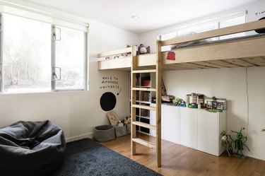 Room with wooden loft bed