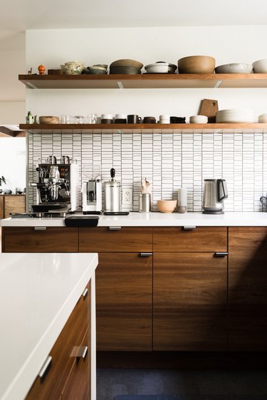 Kitchen with open shelving and counter with espresso machine