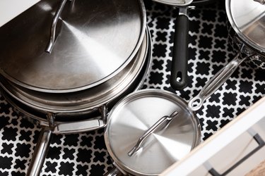 patterned drawer liner with stainless steel pots