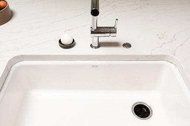 white marble countertop with chrome faucet