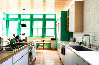 kitchen accent wall of windows with green trim