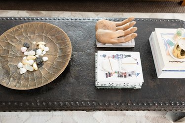 coffee table with low tray holding rocks, with books