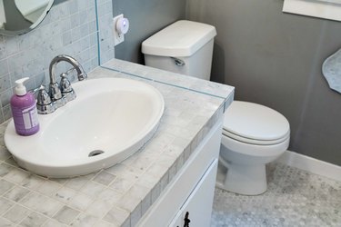 tile bathroom countertop in white and gray bathroom