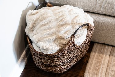 woven basket full of blankets