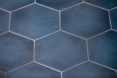 A close up of blue hexagonal floor tile.