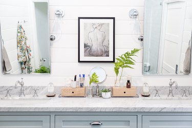 light blue bathroom vanity with marble countertop