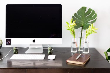 Computer and keyboard on a desk