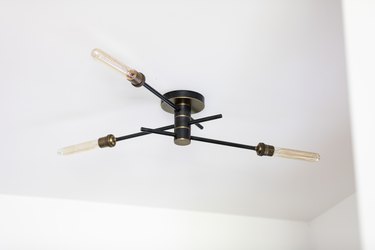Industrial black chandelier lighting with filament lightbulbs
