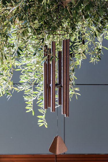 A wind chime attached to a tree