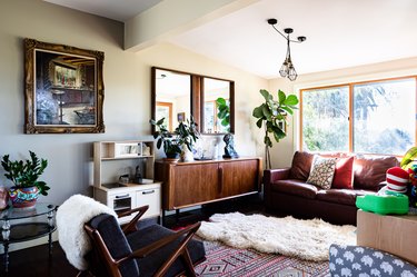 Boho styled living room with cushions and wood furniture