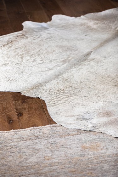 White rugs on a wood floor