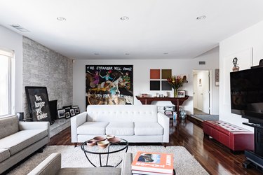 gray living room with colorful artwork