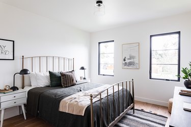 Bedroom with bed that has dark sheets