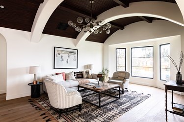 spanish-style living room with small patterned neutral rug