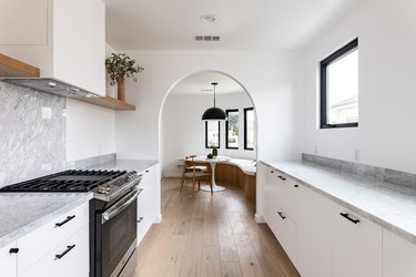 White cabinets with black deals stainless steel appliances