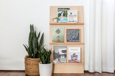 a magazine rack made of plywood and oak shelves