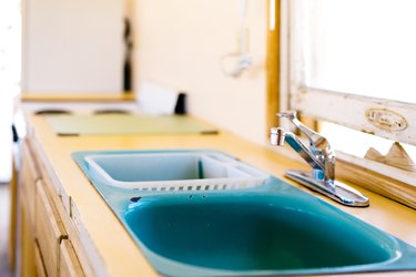 a turquoise-colored double sink