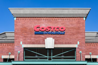 A Costco storefront with a red and blue logo that reads Costco Wholesale.