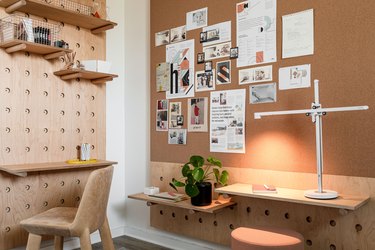 Wood desks with shelving and white industrial lamp