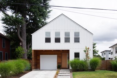 white garage door framed by wood