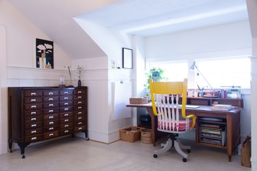 farmhouse style home office with wood desk in front of window