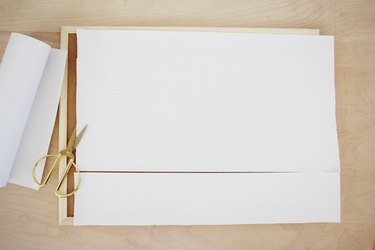 cutting a shelf liner to the same size as the bulletin board frame