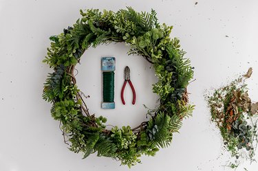 Faux Evergreen Christmas Wreath with wire cutters and green wire