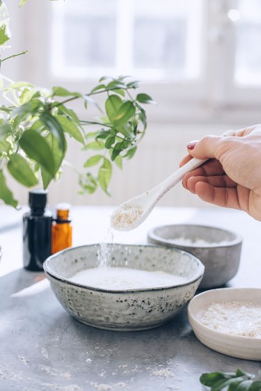 adding soap flakes to a mixture of baking soda and cornstarch