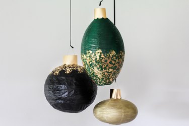 Black, green and gold ornaments with gold leaf