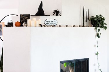 halloween decor on white modern mantel