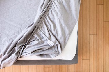 House Cleaning Ideas with a duvet cover strewn over messy bed