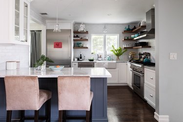 white kitchen with blue-gray island